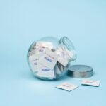 a glass jar filled with lots of tissues