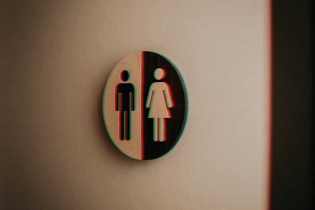 a bathroom sign with a male and female symbol on it
symbolising gender differences